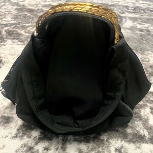 Elegant Black Handbag with Gold Accents